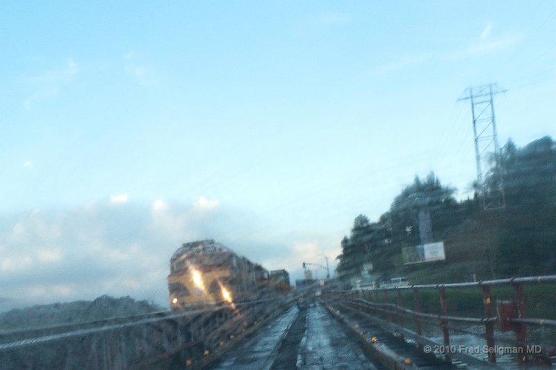 20101204_074150 D3.jpg - As we cross a wooden bridge over the Rio Chagres the Panama Canal train is approaching. Weather conditions add to the effect.